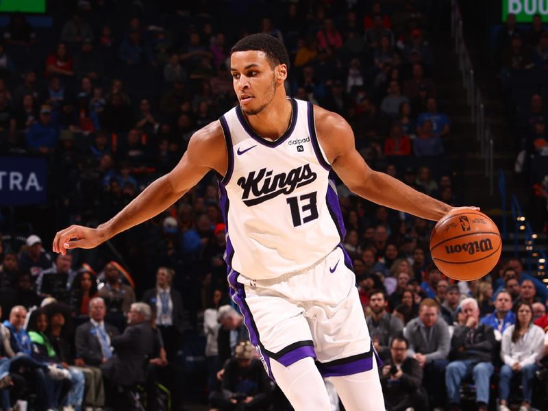 OKLAHOMA CITY, OK - FEBRUARY 11: Keegan Murray #13 of the Sacramento Kings dribbles the ball during the game against the Oklahoma City Thunder on February 11, 2024 at Paycom Arena in Oklahoma City, Oklahoma. NOTE TO USER: User expressly acknowledges and agrees that, by downloading and or using this photograph, User is consenting to the terms and conditions of the Getty Images License Agreement. Mandatory Copyright Notice: Copyright 2024 NBAE (Photo by Zach Beeker/NBAE via Getty Images)