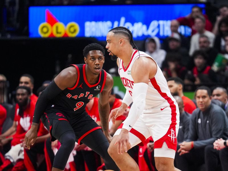 TORONTO, ON - FEBRUARY 9: Dillon Brooks #9 of the Houston Rockets dribbles against RJ Barrett #9 of the Toronto Raptors during the first half of their basketball game at the Scotiabank Arena on February 9, 2024 in Toronto, Ontario, Canada. NOTE TO USER: User expressly acknowledges and agrees that, by downloading and/or using this Photograph, user is consenting to the terms and conditions of the Getty Images License Agreement. (Photo by Mark Blinch/Getty Images)