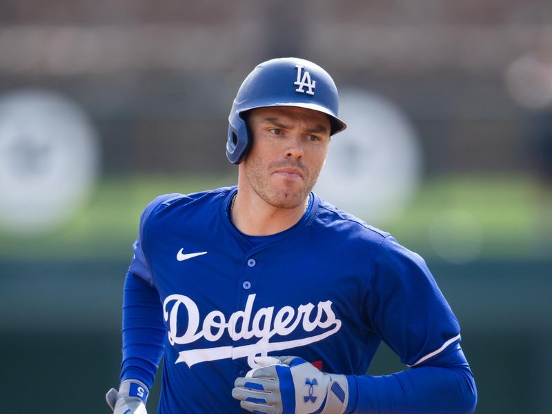 Mar 6, 2024; Phoenix, Arizona, USA; Los Angeles Dodgers first baseman Freddie Freeman rounds the bases after hitting a grand slam home run against the Chicago White Sox during a spring training baseball game at Camelback Ranch-Glendale. Mandatory Credit: Mark J. Rebilas-USA TODAY Sports