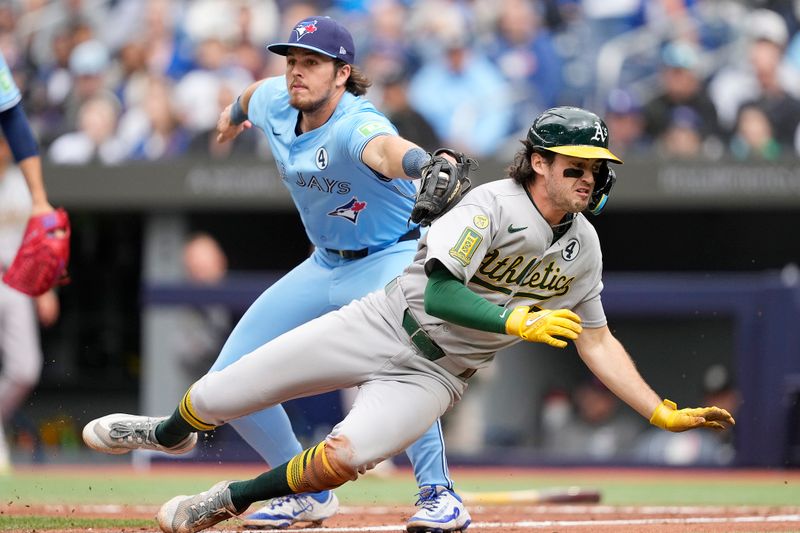 Jun 1, 2025; Toronto, Ontario, CAN; Toronto Blue Jays third baseman Addison Barger (47) tags Oakland Athletics shortstop Jacob Wilson (5) in a run down at home plate during the fifth inning at Rogers Centre. Mandatory Credit: John E. Sokolowski-Imagn Images