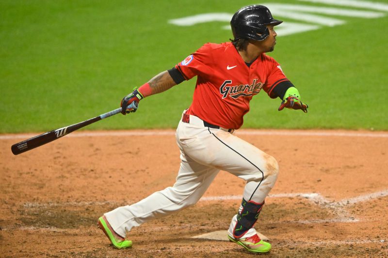 Aug 5, 2024; Cleveland, Ohio, USA; Cleveland Guardians third baseman Jose Ramirez (11) singles in the eighth inning against the Arizona Diamondbacks at Progressive Field. Mandatory Credit: David Richard-USA TODAY Sports