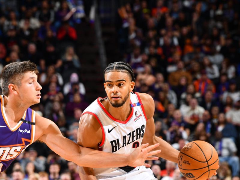 PHOENIX, AZ - NOVEMBER 2: Rayan Rupert #21 of the Portland Trail Blazers dribbles the ball during the game against the Phoenix Suns dribbles the ball during the game against the Portland Trail Blazers on November 2, 2024 at Footprint Center in Phoenix, Arizona. NOTE TO USER: User expressly acknowledges and agrees that, by downloading and or using this photograph, user is consenting to the terms and conditions of the Getty Images License Agreement. Mandatory Copyright Notice: Copyright 2024 NBAE (Photo by Barry Gossage/NBAE via Getty Images)