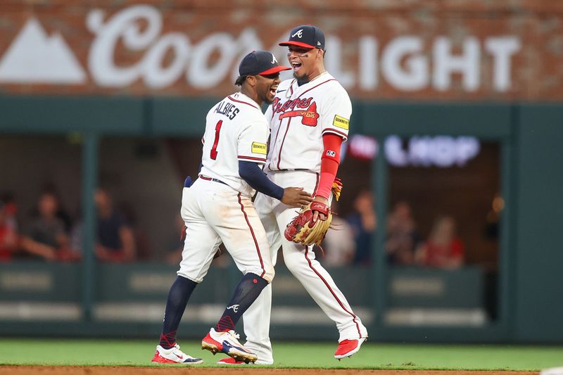 Jun 27, 2023; Atlanta, Georgia, USA; Atlanta Braves second baseman Ozzie Albies (1) and shortstop Orlando Arcia (11) react after an out against the Minnesota Twins in the fifth inning at Truist Park. Mandatory Credit: Brett Davis-USA TODAY Sports