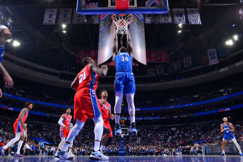 PHILADELPHIA, PA - APRIL 12: Wendell Carter Jr. #34 of the Orlando Magic dunks the ball during the game against the Philadelphia 76ers on April 12, 2024 at the Wells Fargo Center in Philadelphia, Pennsylvania NOTE TO USER: User expressly acknowledges and agrees that, by downloading and/or using this Photograph, user is consenting to the terms and conditions of the Getty Images License Agreement. Mandatory Copyright Notice: Copyright 2024 NBAE (Photo by Jesse D. Garrabrant/NBAE via Getty Images)