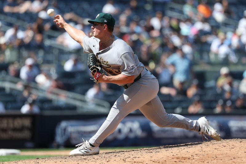 Jun 28, 2025; Bronx, New York, USA; Athletics pitcher Jack Perkins (50) delivers a pitch during the ninth inning against the New York Yankees at Yankee Stadium. Mandatory Credit: Vincent Carchietta-Imagn Images