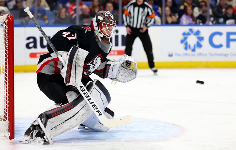 Apr 8, 2025; Buffalo, New York, USA;  Buffalo Sabres goaltender James Reimer (47) looks to make a save during the first period against the Carolina Hurricanes at KeyBank Center. Mandatory Credit: Timothy T. Ludwig-Imagn Images
