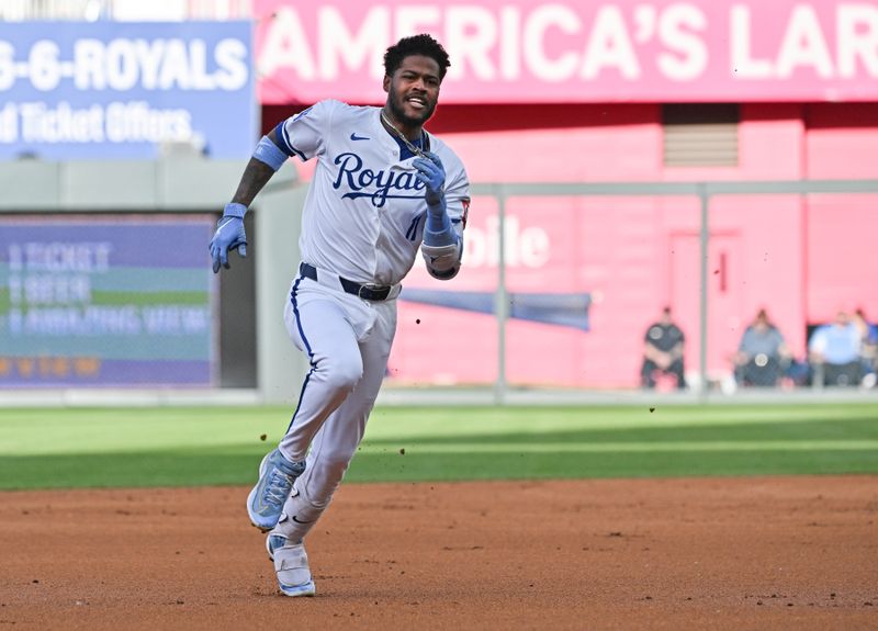 May 21, 2024; Kansas City, Missouri, USA; Kansas City Royals third baseman Maikel Garcia (11) rounds second base for a triple in the first inning against the Detroit Tigers at Kauffman Stadium. Mandatory Credit: Peter Aiken-USA TODAY Sports