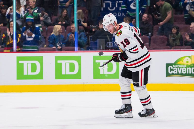 Apr 6, 2023; Vancouver, British Columbia, CAN; Chicago Blackhawks forward Jonathan Toews (19) handles the puck after his team lost to the Vancouver Canucks at Rogers Arena. Canucks won 3-0. Mandatory Credit: Bob Frid-USA TODAY Sports