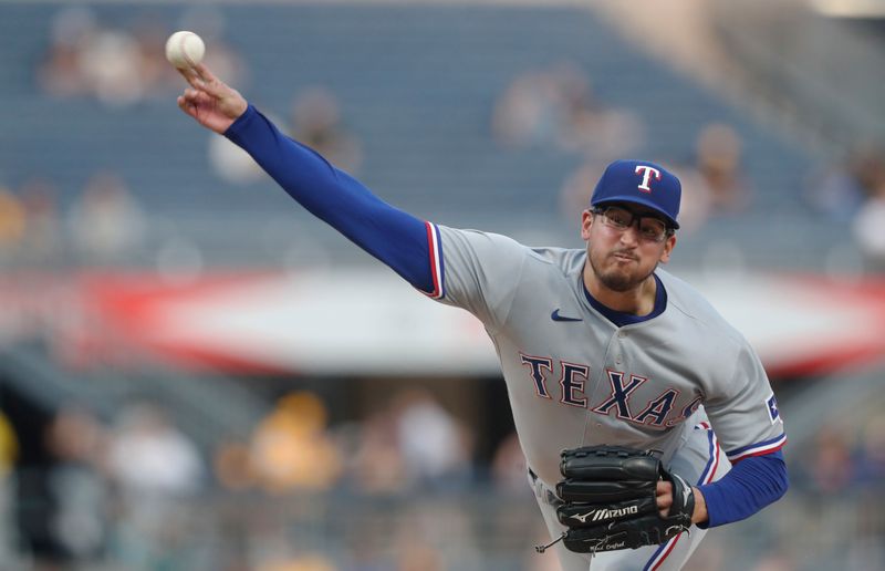 May 22, 2023; Pittsburgh, Pennsylvania, USA;  Texas Rangers starting pitcher Dane Dunning (33) pitches against the Pittsburgh Pirates during the fifth inning at PNC Park. Mandatory Credit: Charles LeClaire-USA TODAY Sports