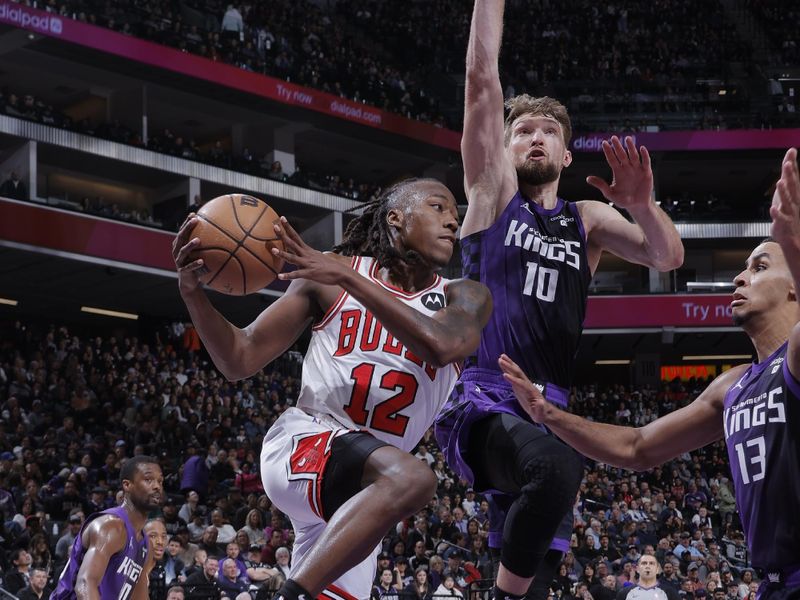 SACRAMENTO, CA - MARCH 4:  Ayo Dosunmu #12 of the Chicago Bulls handles the ball during the game against the Sacramento Kings on March 4, 2024 at Golden 1 Center in Sacramento, California. NOTE TO USER: User expressly acknowledges and agrees that, by downloading and or using this Photograph, user is consenting to the terms and conditions of the Getty Images License Agreement. Mandatory Copyright Notice: Copyright 2024 NBAE (Photo by Rocky Widner/NBAE via Getty Images)