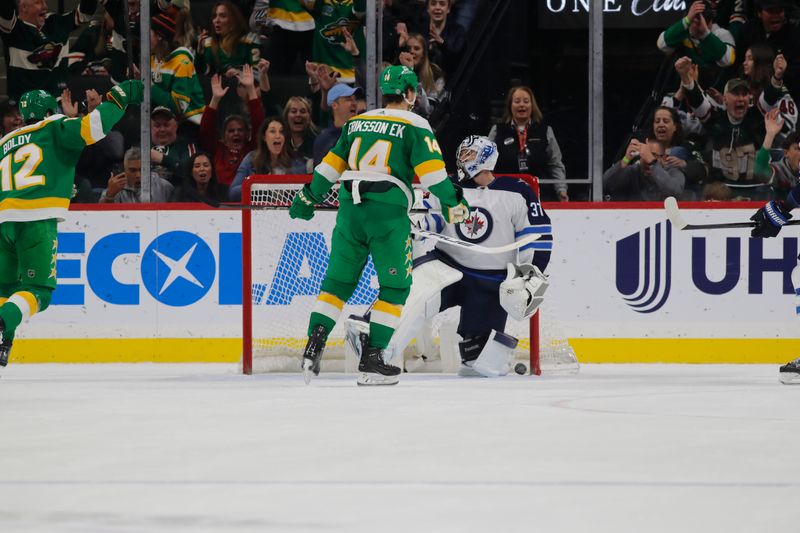 Apr 6, 2024; Saint Paul, Minnesota, USA; Winnipeg Jets goaltender Connor Hellebuyck (37) reacts after allowing a goal by Minnesota Wild left wing Kirill Kaprizov (not pictured) during the first period at Xcel Energy Center. Mandatory Credit: Bruce Fedyck-USA TODAY Sports