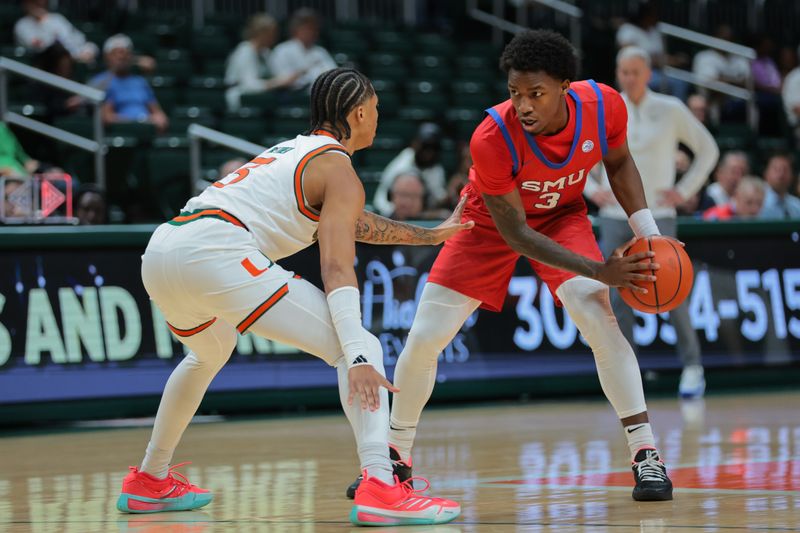 Jan 18, 2025; Coral Gables, Florida, USA; Southern Methodist Mustangs guard Chuck Harris (3) protects the basketball from Miami Hurricanes guard Jalil Bethea (3) during the first half at Watsco Center. Mandatory Credit: Sam Navarro-Imagn Images