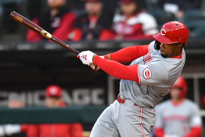 Apr 12, 2024; Chicago, Illinois, USA; Cincinnati Reds center fielder Will Benson (30) hits a double during the first inning against the Chicago White Sox at Guaranteed Rate Field. Mandatory Credit: Patrick Gorski-USA TODAY Sports