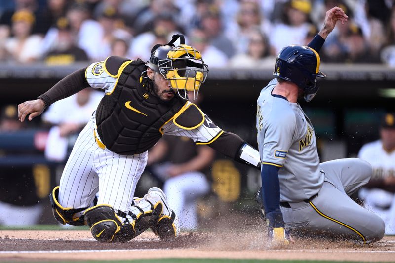 Jun 20, 2024; San Diego, California, USA; Milwaukee Brewers second baseman Brice Turang (right) scores a run ahead of the tag by San Diego Padres catcher Luis Campusano (left) during the first inning at Petco Park. Mandatory Credit: Orlando Ramirez-USA TODAY Sports