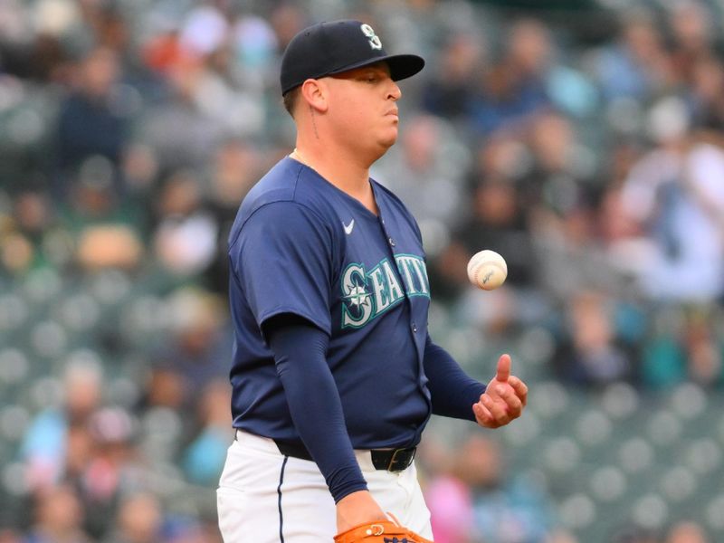 Jun 11, 2024; Seattle, Washington, USA; Seattle Mariners starting pitcher Jhonathan Diaz (74) reacts to a home run hit by Chicago White Sox first baseman Andrew Vaughn (25) (not pictured) during the third inning at T-Mobile Park. Mandatory Credit: Steven Bisig-USA TODAY Sports