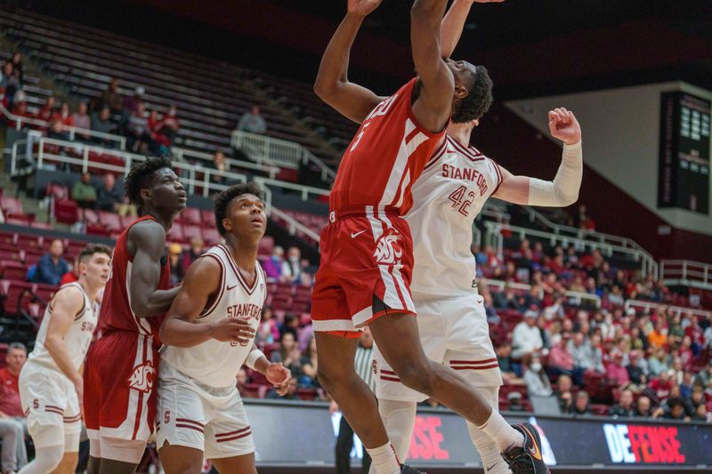 Feb 23, 2023; Stanford, California, USA;  Washington State Cougars guard TJ Bamba (5) shoots a layup against Stanford Cardinal forward Maxime Raynaud (42) during the second half at Maples Pavilion. Mandatory Credit: Neville E. Guard-USA TODAY Sports