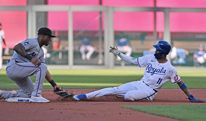 Jun 25, 2024; Kansas City, Missouri, USA; Kansas City Royals second baseman Maikel Garcia (11) steals second base against Miami Marlins shortstop Tim Anderson (7) in the first inning against the at Kauffman Stadium. Mandatory Credit: Peter Aiken-USA TODAY Sports