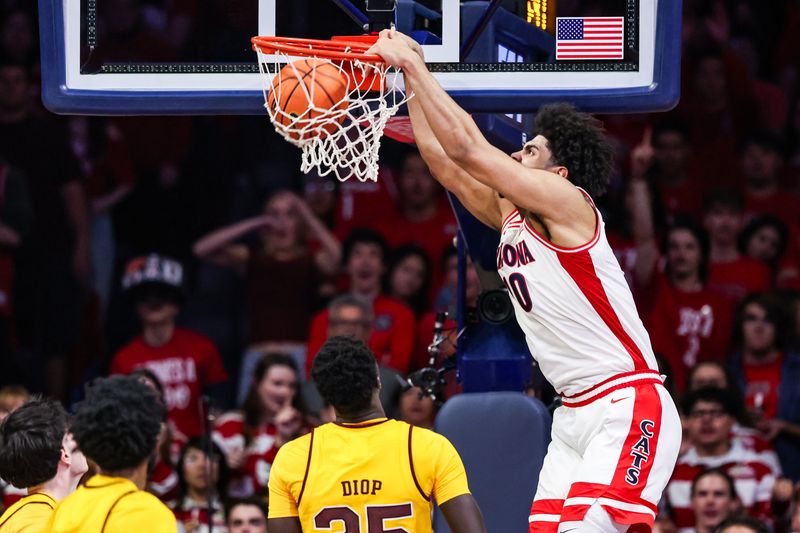 Jan 14, 2026; Tucson, Arizona, USA; Arizona Wildcats forward Koa Peat (10) dunks the ball during the first half of the game against the Arizona State Sun Devils at McKale Memorial Center. Mandatory Credit: Aryanna Frank-Imagn Images