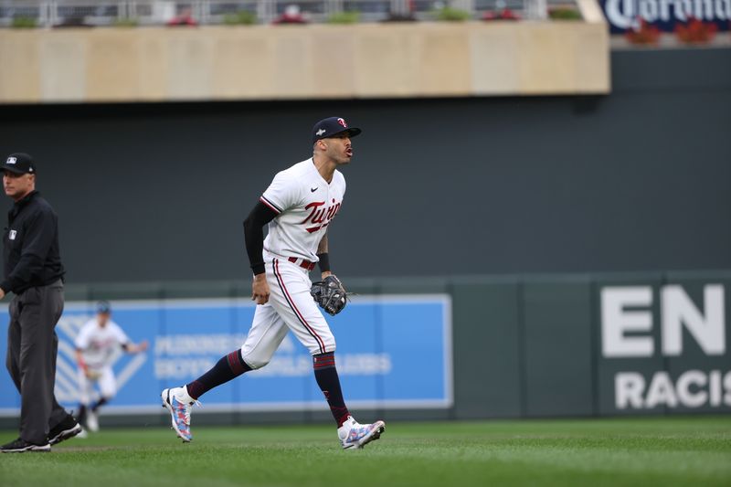 Oct 4, 2023; Minneapolis, Minnesota, USA; Minnesota Twins shortstop Carlos Correa (4) celebrates a play in the fifth inning against the Toronto Blue Jays during game two of the Wildcard series for the 2023 MLB playoffs at Target Field. Mandatory Credit: Jesse Johnson-USA TODAY Sports