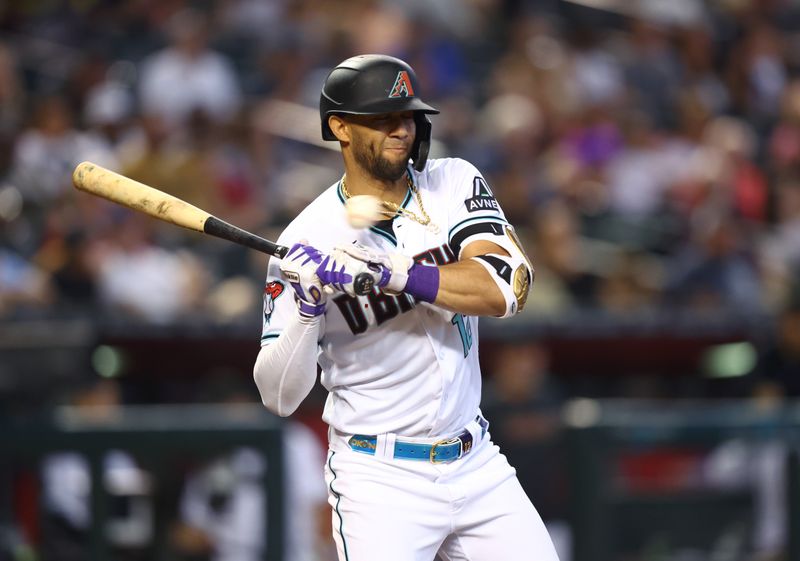 Aug 27, 2023; Phoenix, Arizona, USA; Arizona Diamondbacks batter Lourdes Gurriel Jr. reacts to an inside pitch in the second inning against the Cincinnati Reds at Chase Field. Mandatory Credit: Mark J. Rebilas-USA TODAY Sports
