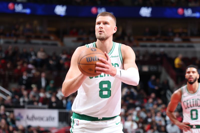 CHICAGO, IL - NOVEMBER 29: Kristaps Porzingis #8 of the Boston Celtics shoots a free throw during the game against the Chicago Bulls during the Emirates NBA Cup game on November 29, 2024 at United Center in Chicago, Illinois. NOTE TO USER: User expressly acknowledges and agrees that, by downloading and or using this photograph, User is consenting to the terms and conditions of the Getty Images License Agreement. Mandatory Copyright Notice: Copyright 2024 NBAE (Photo by Jeff Haynes/NBAE via Getty Images)