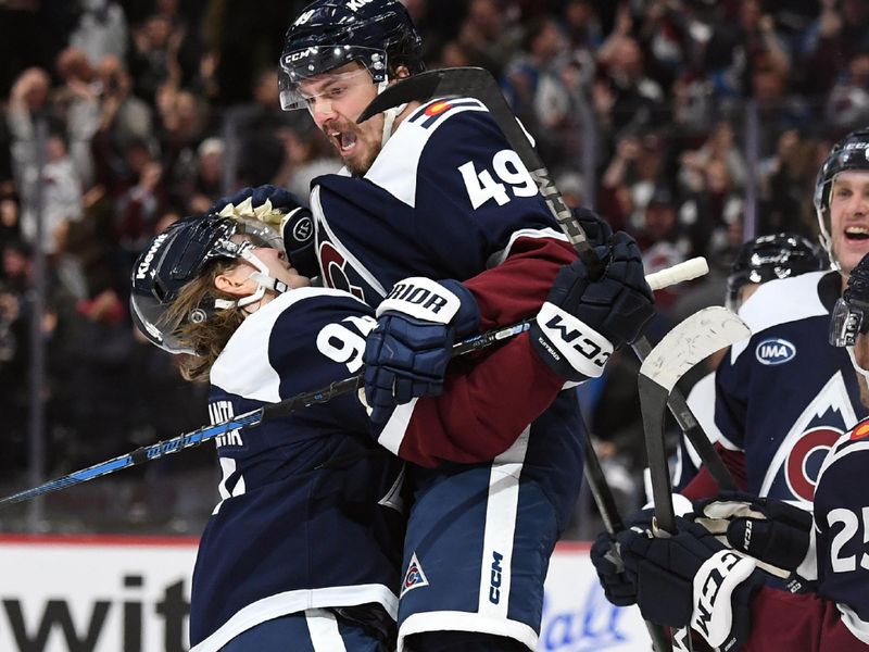 Nov 11, 2024; Denver, Colorado, USA; Colorado Avalanche defenseman Samuel Girard (49) celebrates with teammates after a game-winning goal in overtime to beat the Nashville Predators at Ball Arena. Mandatory Credit: Christopher Hanewinckel-Imagn Images