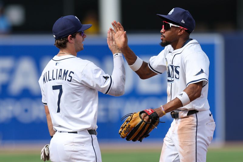 Sep 18, 2025; Tampa, Florida, USA; Tampa Bay Rays shortstop Carson Williams (7) and center fielder Chandler Simpson (14) react after beating the Toronto Blue Jays at George M. Steinbrenner Field. Mandatory Credit: Nathan Ray Seebeck-Imagn Images