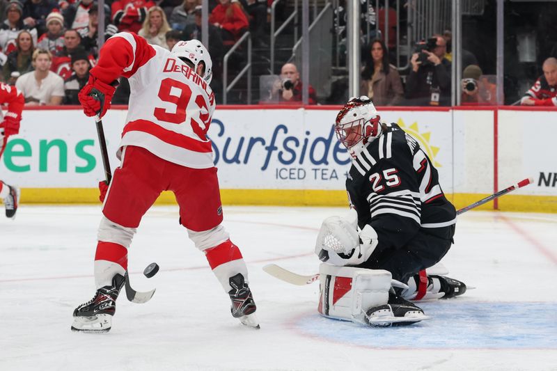 Nov 24, 2025; Newark, New Jersey, USA; Detroit Red Wings right wing Alex Debrincat (93) looks for the puck after a save by New Jersey Devils goaltender Jacob Markstrom (25) during the first period at Prudential Center. Mandatory Credit: Ed Mulholland-Imagn Images