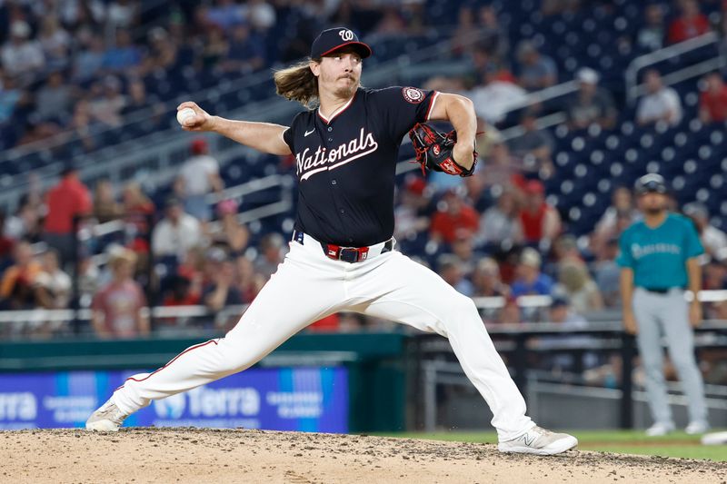 May 24, 2024; Washington, District of Columbia, USA; Washington Nationals pitcher Hunter Harvey (73) pitches against the Seattle Mariners during the eighth inning at Nationals Park. Mandatory Credit: Geoff Burke-USA TODAY Sports