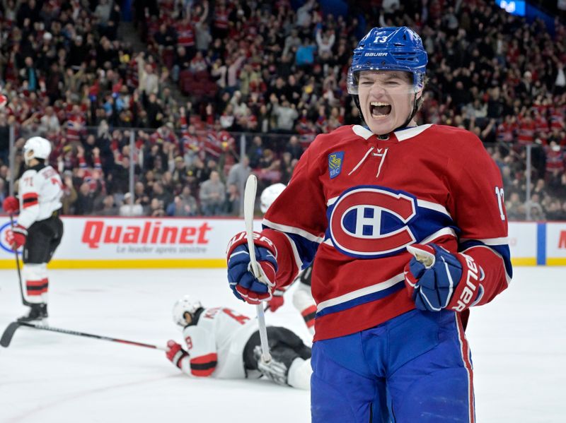 Jan 25, 2025; Montreal, Quebec, CAN; Montreal Canadiens forward Cole Caufield (13) celebrates after scoring a goal against the New Jersey Devils during the second period at the Bell Centre. Mandatory Credit: Eric Bolte-Imagn Images