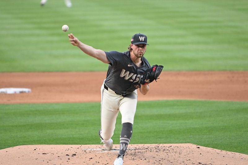 Aug 2, 2024; Washington, District of Columbia, USA; Washington Nationals starting pitcher Jake Irvin (27) throws a pitch against the Milwaukee Brewers during the second inning at Nationals Park. Mandatory Credit: Rafael Suanes-USA TODAY Sports