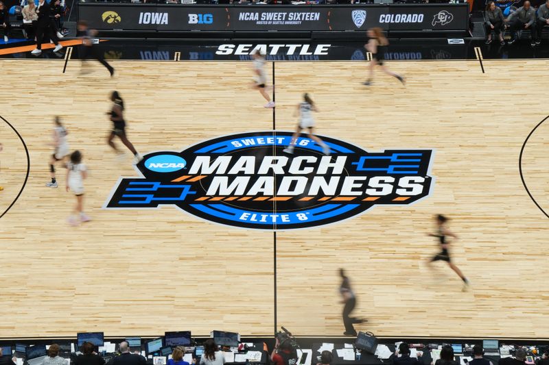 Mar 24, 2023; Seattle, WA, USA; A general overall view of the March Madness Sweet 16 and Elite 8 logo at center court at Climate Pledge Arena. Mandatory Credit: Kirby Lee-USA TODAY Sports