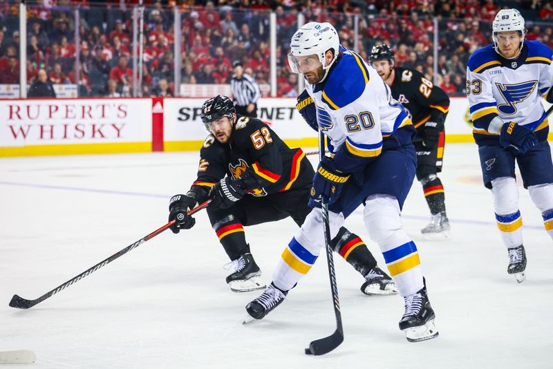 Jan 23, 2024; Calgary, Alberta, CAN; St. Louis Blues left wing Brandon Saad (20) controls the puck against the Calgary Flames during the third period at Scotiabank Saddledome. Mandatory Credit: Sergei Belski-USA TODAY Sports