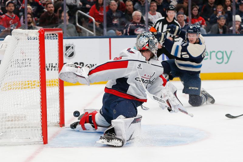 Oct 24, 2025; Columbus, Ohio, USA; Washington Capitals goalie Logan Thompson (48) makes a pad save on the shot attempt of Columbus Blue Jackets left wing Dmitri Voronkov (10)during the second period at Nationwide Arena. Mandatory Credit: Russell LaBounty-Imagn Images