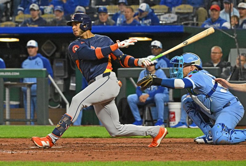 Apr 26, 2025; Kansas City, Missouri, USA;  Houston Astros shortstop Jeremy Pena (3) singles in the eighth inning against the Kansas City Royals at Kauffman Stadium. Mandatory Credit: Peter Aiken-Imagn Images