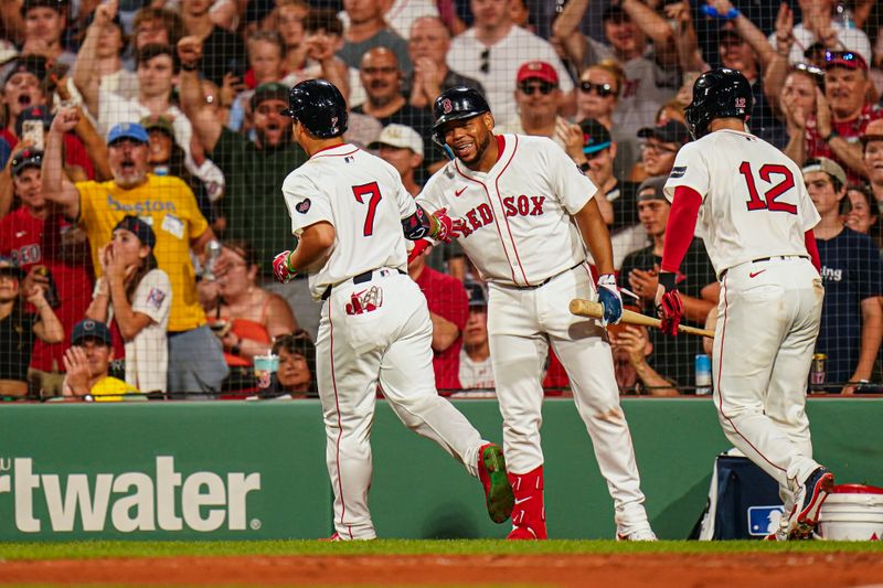 Jul 11, 2024; Boston, Massachusetts, USA; Boston Red Sox designated hitter Masataka Yoshida (7) is congratulated by first baseman Dominic Smith (2) after hitting a two run home run against the Oakland Athletics in the sixth inning at Fenway Park. Mandatory Credit: David Butler II-USA TODAY Sports
