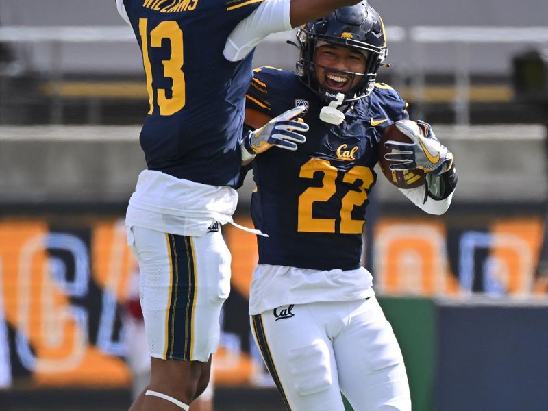 Sep 30, 2023; Berkeley, California, USA; California Golden Bears defensive back Matthew Littlejohn (22) celebrates with defensive back Miles Williams (13) after intercepting a pass against the Arizona State Sun Devils during the fourth quarter at California Memorial Stadium. Mandatory Credit: Robert Edwards-USA TODAY Sports