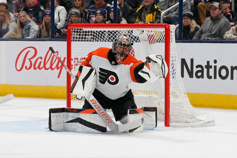 Apr 6, 2024; Columbus, Ohio, USA; Philadelphia Flyers goalie Samuel Ersson (33) makes a glove save against the Columbus Blue Jackets during the first period at Nationwide Arena. Mandatory Credit: Russell LaBounty-USA TODAY Sports