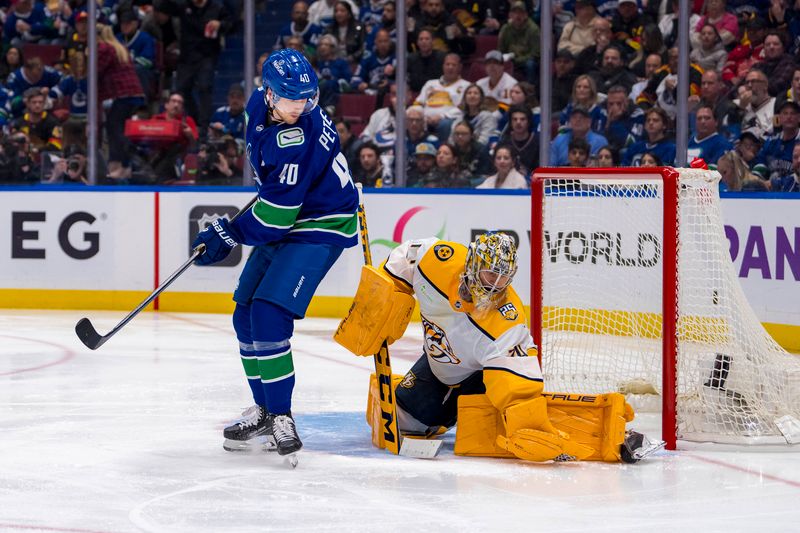 Apr 21, 2024; Vancouver, British Columbia, CAN; Nashville Predators goalie Juuse Saros (74) makes a save as Vancouver Canucks forward Elias Pettersson (40) looks for the rebound in the third period in game one of the first round of the 2024 Stanley Cup Playoffs at Rogers Arena. Mandatory Credit: Bob Frid-USA TODAY Sports