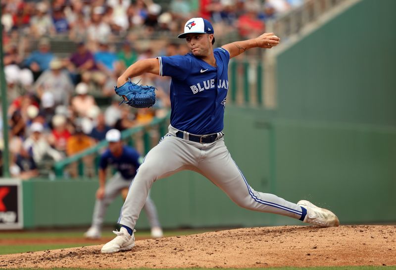 Mar 3, 2024; Fort Myers, Florida, USA; Toronto Blue Jays pitcher Mason Fluharty (84) throws a pitch during the third inning against the Boston Red Sox at JetBlue Park at Fenway South. Mandatory Credit: Kim Klement Neitzel-USA TODAY Sports