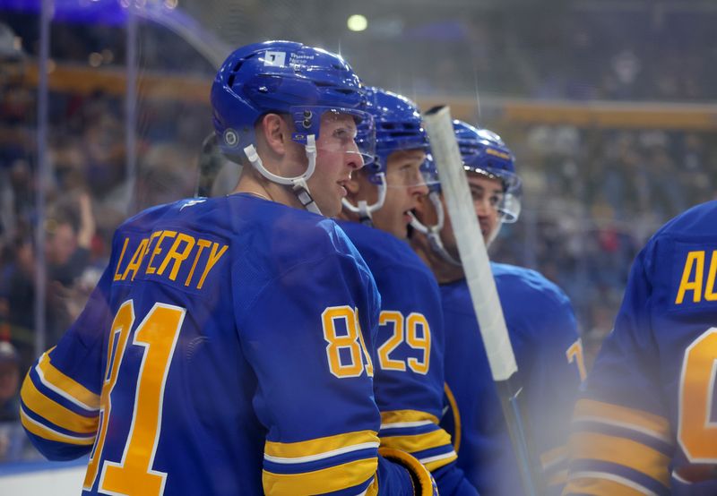 Sep 21, 2024; Buffalo, New York, USA;  Buffalo Sabres center Sam Lafferty (81) celebrates his goal with teammates during the second period against the Pittsburgh Penguins at KeyBank Center. Mandatory Credit: Timothy T. Ludwig-Imagn Images