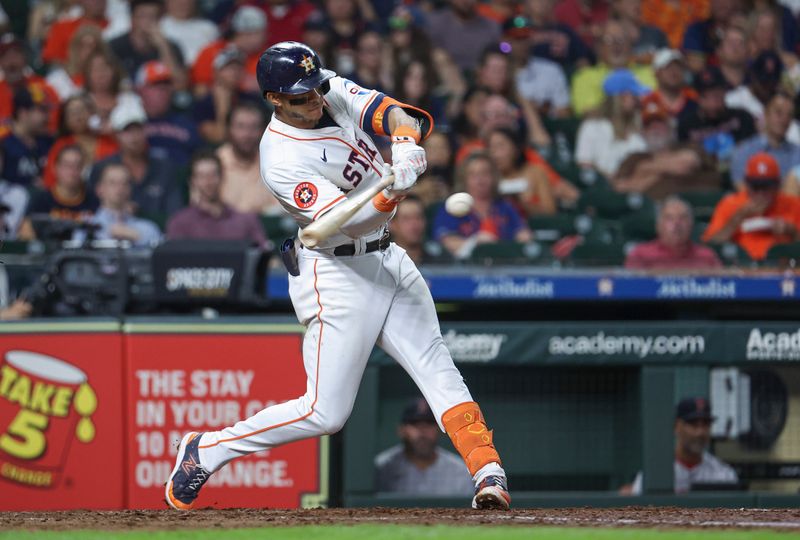 Aug 20, 2024; Houston, Texas, USA; Houston Astros shortstop Jeremy Pena (3) hits a double during the third inning against the Boston Red Sox at Minute Maid Park. Mandatory Credit: Troy Taormina-USA TODAY Sports