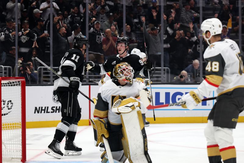 Oct 30, 2024; Los Angeles, California, USA; Los Angeles Kings center Anze Kopitar (11) celebrates with defenseman Brandt Clarke (92) after scoring a goal during the second period against the Vegas Golden Knights at Crypto.com Arena. Mandatory Credit: Kiyoshi Mio-Imagn Images