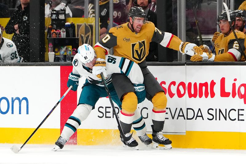 Oct 26, 2024; Las Vegas, Nevada, USA; San Jose Sharks right wing Carl Grundstrom (91) interferes with Vegas Golden Knights left wing Tanner Pearson (70) during the second period at T-Mobile Arena. Mandatory Credit: Stephen R. Sylvanie-Imagn Images