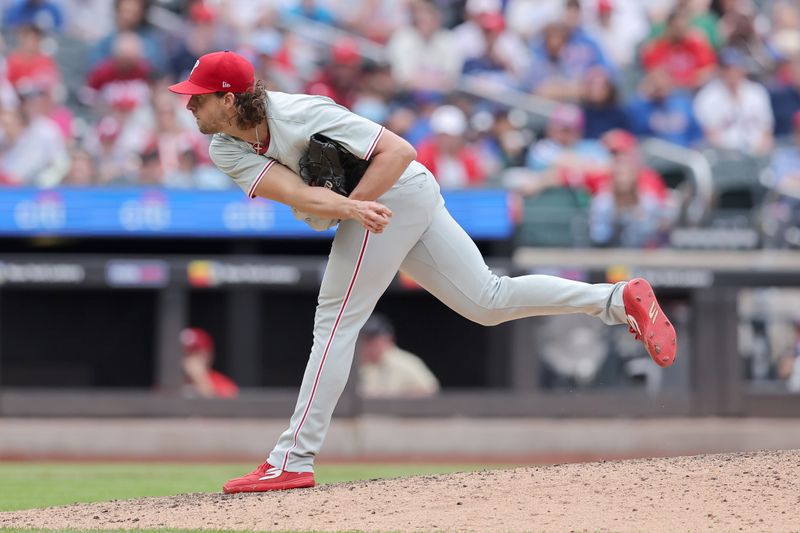 May 14, 2024; New York City, New York, USA; Philadelphia Phillies starting pitcher Aaron Nola (27) follows through on a pitch against the New York Mets during the ninth inning at Citi Field. Mandatory Credit: Brad Penner-USA TODAY Sports