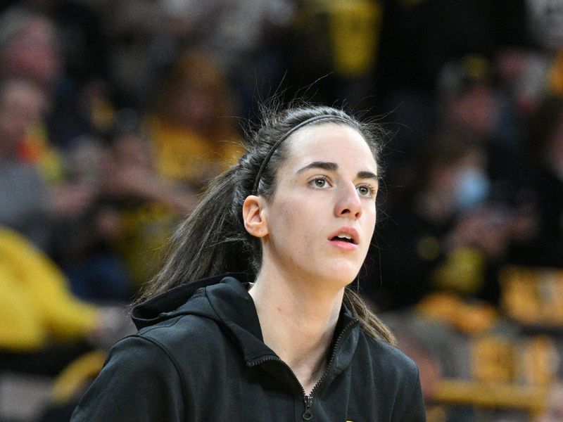 Mar 3, 2024; Iowa City, Iowa, USA; Iowa Hawkeyes guard Caitlin Clark (22) warms up before the game against the Ohio State Buckeyes at Carver-Hawkeye Arena. Clark is attempting to break the NCAA basketball all-time scoring record. Mandatory Credit: Jeffrey Becker-USA TODAY Sports