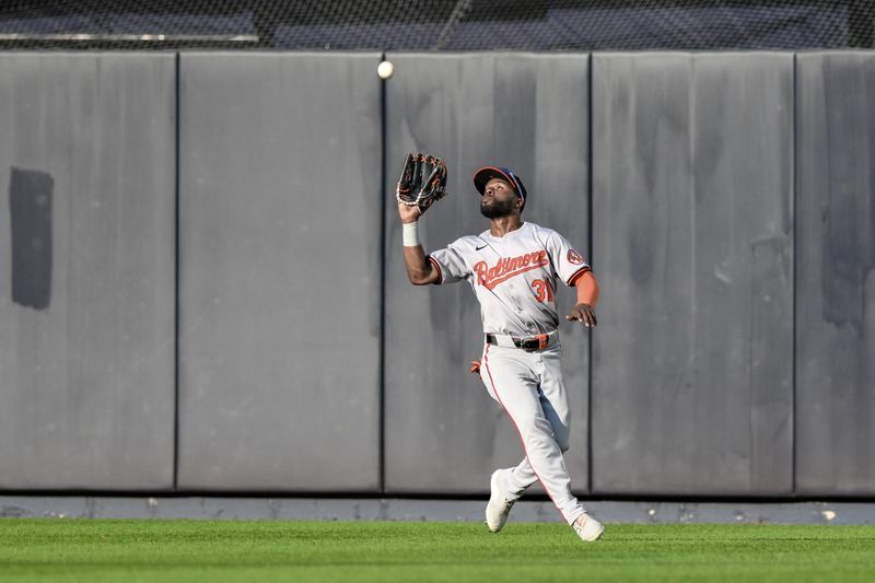 Jun 20, 2024; Bronx, New York, USA; Baltimore Orioles outfielder Cedric Mullins (31) catches a fly ball during the seventh inning against the New York Yankees at Yankee Stadium. Mandatory Credit: John Jones-USA TODAY Sports