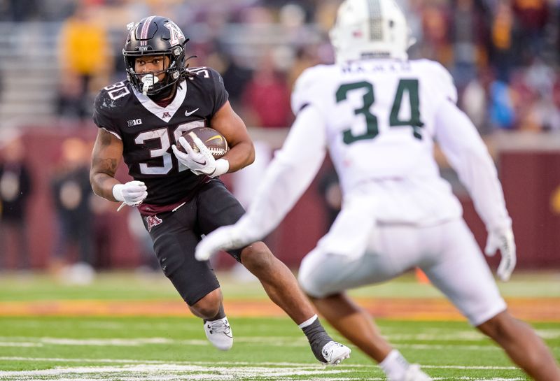 Oct 28, 2023; Minneapolis, Minnesota, USA;  Minnesota Golden Gophers running back Jordan Nubin (30) runs with the ball against the Michigan State Spartans during the fourth quarter at Huntington Bank Stadium. Mandatory Credit: Nick Wosika-USA TODAY Sports