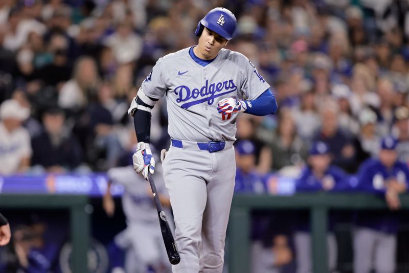 Sep 26, 2025; Seattle, Washington, USA; Los Angeles Dodgers designated hitter Shohei Ohtani (17) reacts after being hit by a pitch from Seattle Mariners pitcher George Kirby (not pictured) during the third inning at T-Mobile Park. Mandatory Credit: John Froschauer-Imagn Images