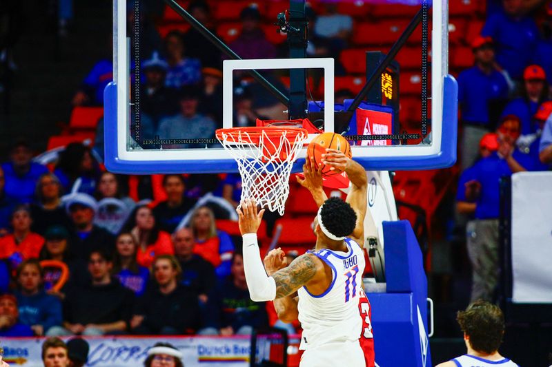 Feb 1, 2024; Boise, Idaho, USA; Boise State Broncos guard Chibuzo Agbo (11) blocks the shot of Fresno State Bulldogs guard Leo Colimerio (23) during the second half at ExtraMile Arena. Boise State defeats Fresno State 90-66. Mandatory Credit: Brian Losness-USA TODAY Sports

